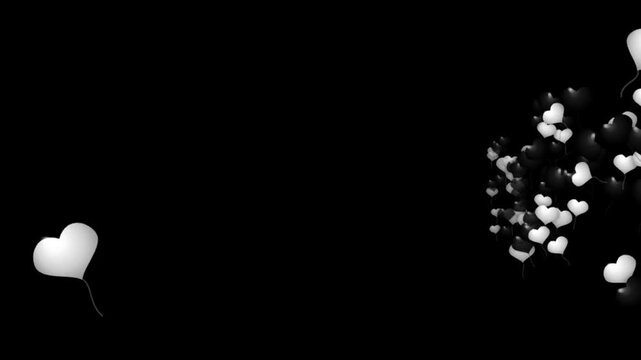 Elegant black and white heart balloons float majestically across a pure dark background perfect fo