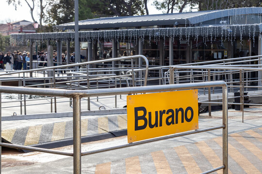 Yellow "Burano" destination sign at the island's ferry terminal, Venice, Italy