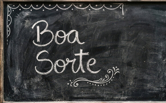 Boa Sorte escrito a giz em lousa preta, conceito de sucesso e motivacao para mensagem positiva