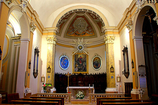 MONDAVIO, ITALY - AUGUST 9, 2025: Collegiata dei SS. Pietro e Paterniano. At the center of the apse stands "the Virgin of the Assumption with St John the Evangelist and St Catherine of Alexandria"