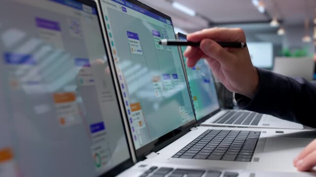 Young Businessman Managing Automated Workflow System On Laptop