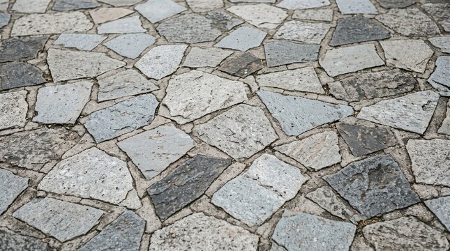 Stone pavement path with irregular flagstones in daylight