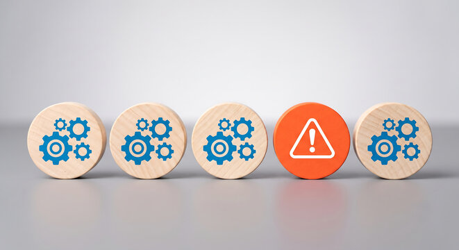 Wooden blocks with gear icons and warning sign. Concept of technical error or system failure.
 Concept AI