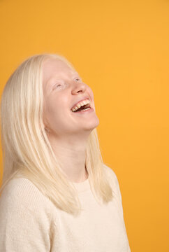 Close-up portrait of smiling woman with pale features blonde hair