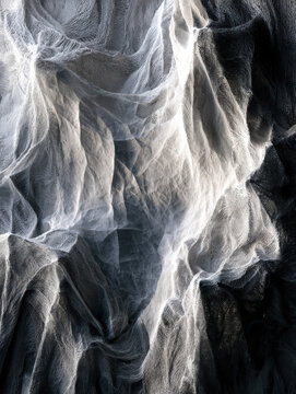 Taut fabric billows like wind-tossed clouds