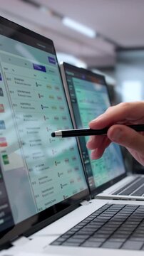 Compliance Officer Reviews Regulatory Exam Findings On Laptop