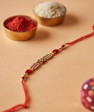 Decorative Rakhi with Kumkum and Rice