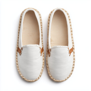 Pair of white canvas espadrilles loafers isolated on white background