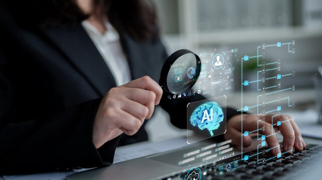 Professional examining artificial intelligence data on laptop with digital overlay showcasing technology concepts and analytics in a modern office environment. Sentient.