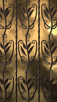 Decorative wrought iron grate with golden bokeh background