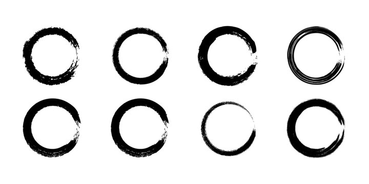 Collection of black brushstroke circles on a white background abstract design elements