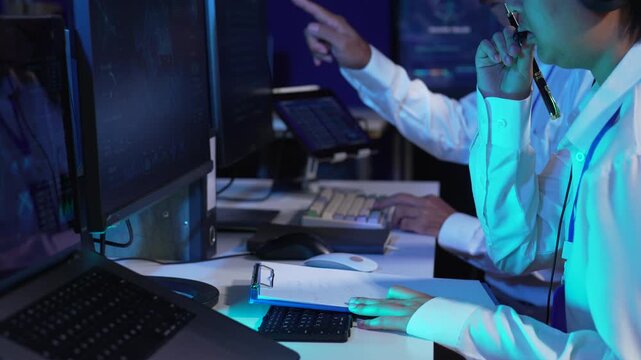 Air traffic controller monitors flight radar screens in a modern dark command center, aviation technology, flight safety, surveillance and precision.