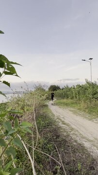 Person Jogging on a Countryside Path