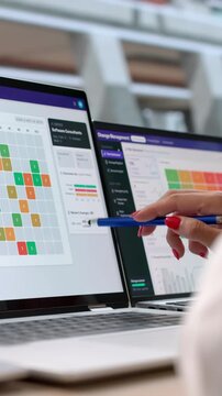 IT Manager Reviews Change Request Workflow On Laptop