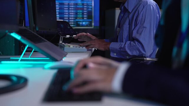 Air traffic controller monitors flight radar screens in a modern dark command center, aviation technology, flight safety, surveillance and precision.