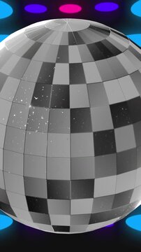 Animation of disco ball over colorful spots on black background