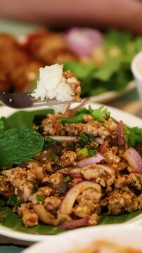 Traditional Thai Larb Moo Spicy Minced Pork Salad with Sticky Rice
