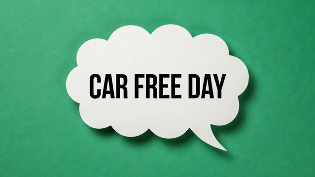 A white speech bubble sign with the text Car Free Day isolated on a green background. Concept for sustainable urban transport and environment awareness.