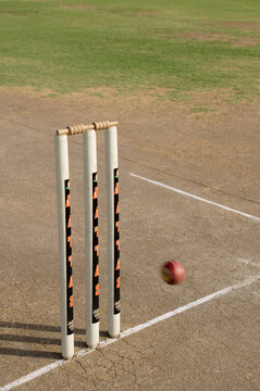 Cricket ball approaching stumps 