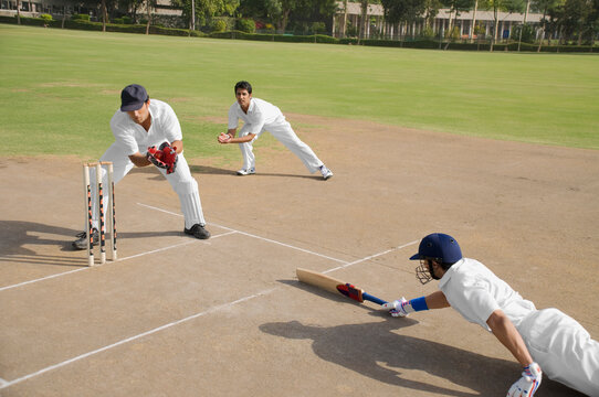Cricketers in action 