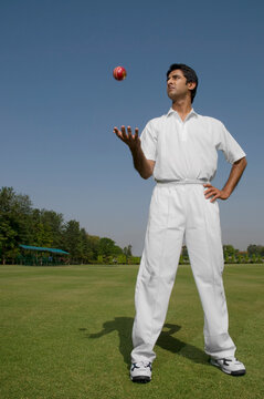 Bowler tossing a ball 