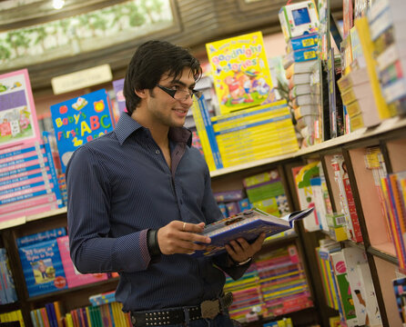 Man selecting a book 