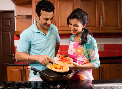 Couple cooking in the kitchen together 