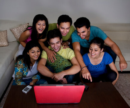 Friends looking at a computer 