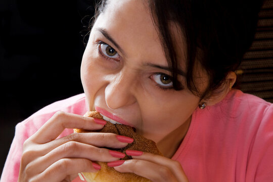 Woman eating a burger 