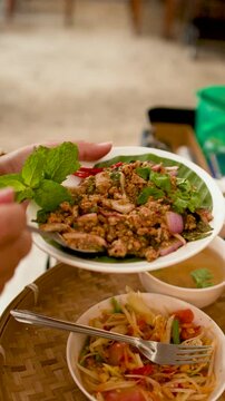 Traditional Thai Larb Moo Minced Pork Salad and Papaya Salad