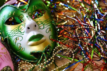 mardi gras carnival mask between confetti © Adriana