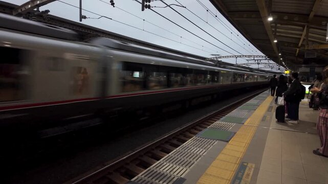 Commuter train arriving at a japanese train station platform