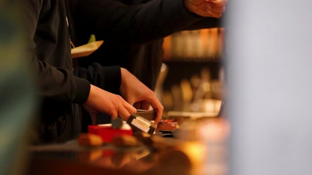 Close Up of Hands Preparing Street Food at Tokyo Night Market