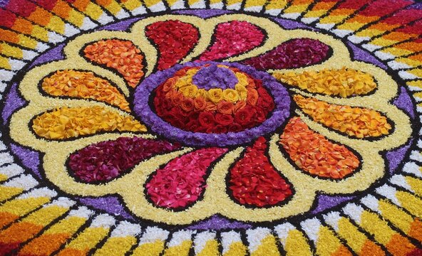 pookalam designs for onam celebrations , pookalam made for part of onam celibration in kerala, india. it also referred to as athapookalam, is often made in a circular shape with flowers on floor