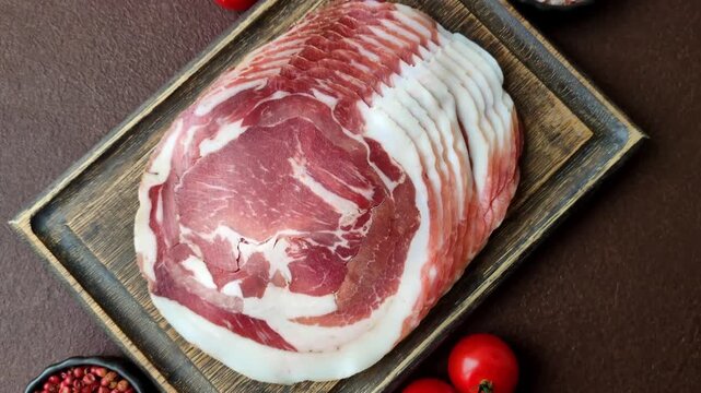 Slices of pork pancetta, ham, or bacon for a festive antipasto platter