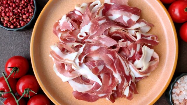 Slices of pork pancetta, ham, or bacon for a festive antipasto platter
