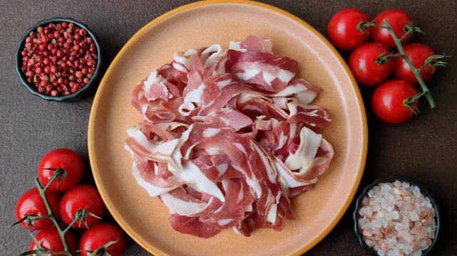 Slices of pork pancetta, ham, or bacon for a festive antipasto platter