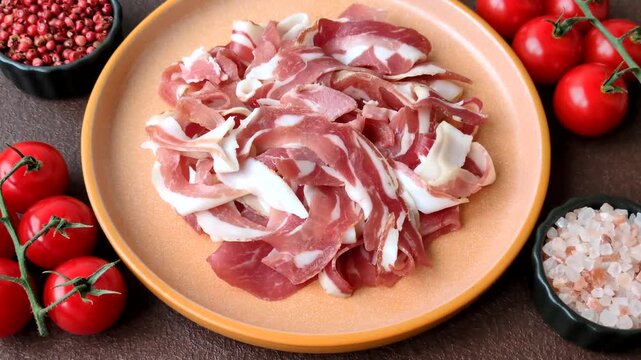 Slices of pork pancetta, ham, or bacon for a festive antipasto platter