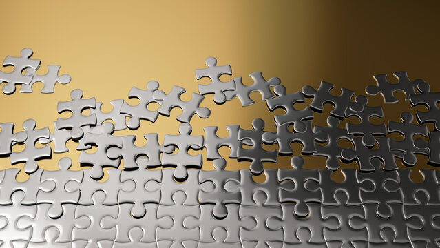 Partially Completed Gold and Silver Jigsaw Puzzle Backdrop with scattered Pieces. Potential Concept with copy-space.