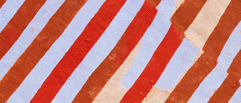 Abstract textile pattern with interlocking brush ribbons in lilac, red, and brown, featuring a tactile canvas texture for cultural event backgrounds