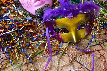 mardi gras carnival mask between confetti © Adriana
