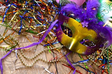 mardi gras carnival mask between confetti © Adriana