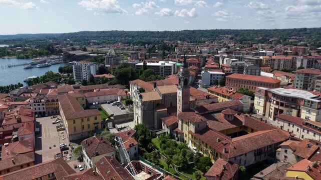Aerial Orbit Around Holy Martyrs Church and Bell Tower in Arona, Italy