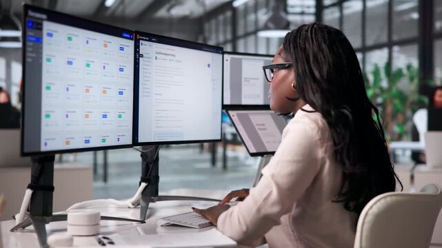 Female Office Manager Efficiently Organizes Digital Files