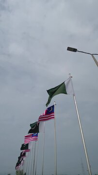 Waving Flags of Pakistan and Malaysia Together, Bilateral Relations and Friendship Concept