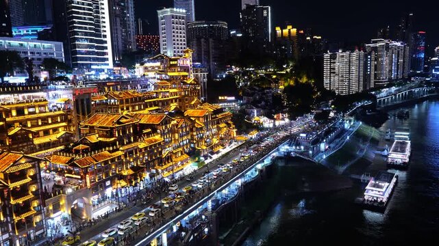 Hongyadong stilt building complex illuminated at night, Chongqing skyline, China. panoramic view.