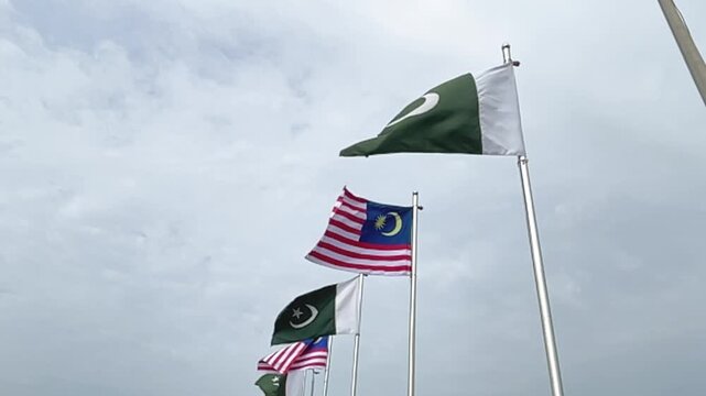 Pakistan and Malaysia Flags Waving in Slow Motion, Bilateral Relations and International Friendship Concept