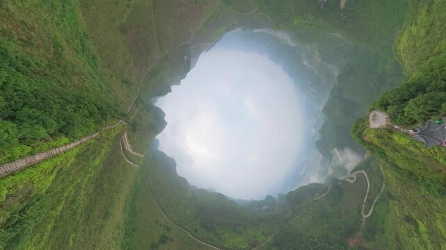 Drone view tunnel effect landscape of green mountains, footpath, Chinese style pavilion in Fengtang village, Hechi, Guangxi, China, 4k real time footage travel concept b roll shot.