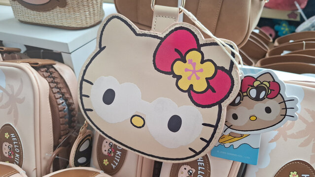 Miniso Sanrio Hello Kitty Character Shaped Leather Bag With Hibiscus Bow In Store on August 17, 2026 in Bangkok,  Thailand