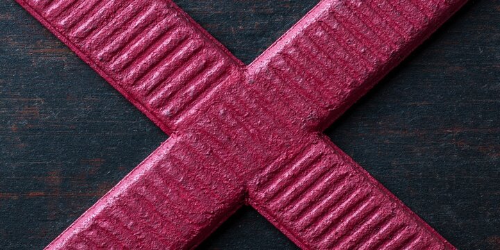 Close-up of red metal cross structure